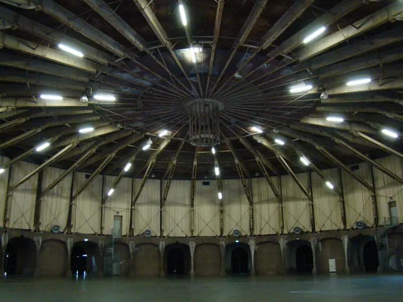 The empty round hall of the Gashouder in Amsterdam under its radial steel roof