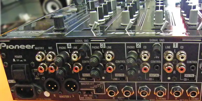 Back panel of a Pioneer DJM-800 mixer with the MASTER 2, REC and BOOTH outputs next to the channel inputs